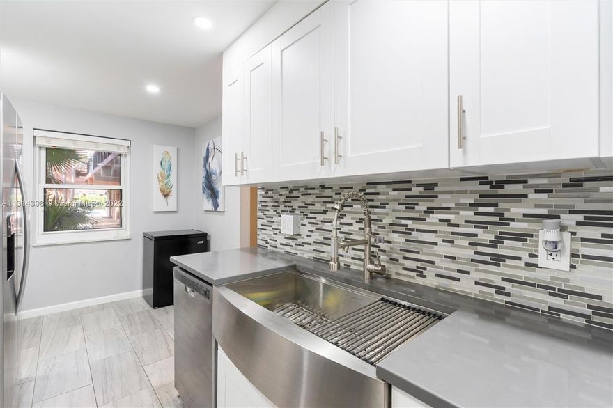 Our beautiful condo is totally upgraded with a smart home system, brand-new kitchen, appliances, new tiled floors, a new AC and impact windows. This condo is two stories with a private back yard with an area perfect for grilling, enjoying your own space or gardening. This home is located in the famous Tennis Club of Ft Lauderdale. This is a quiet, peaceful community, along the Middle River, with a tennis club that has 20 Clay /3 Hard Courts. (10 Lighted), Heated Pool, Spa, fully equipped Gym, Patio Bar & Grille. This Gated Community has 24/7 Security. The community offers Social Activities and provides a great location close to beautiful Beaches, Shopping, Wilton Manors, Downtown, Airport. Check it out, it is Fort Lauderdale's best kept secret.