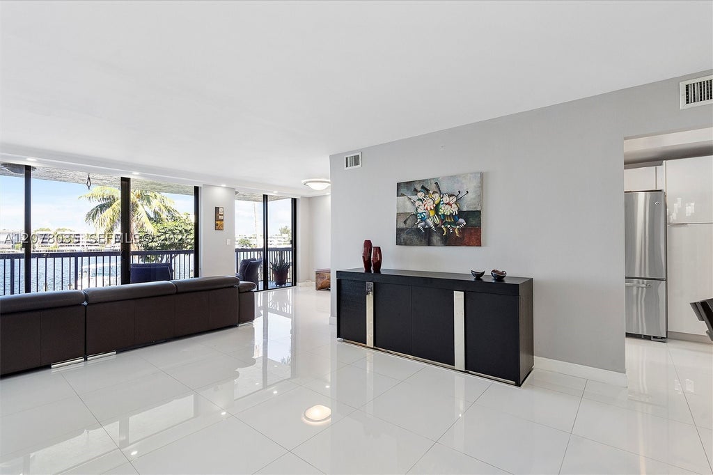 Photo of 200 Golden Isles Dr #206, Hallandale Beach, FL 33009 (MLS # A12078035)