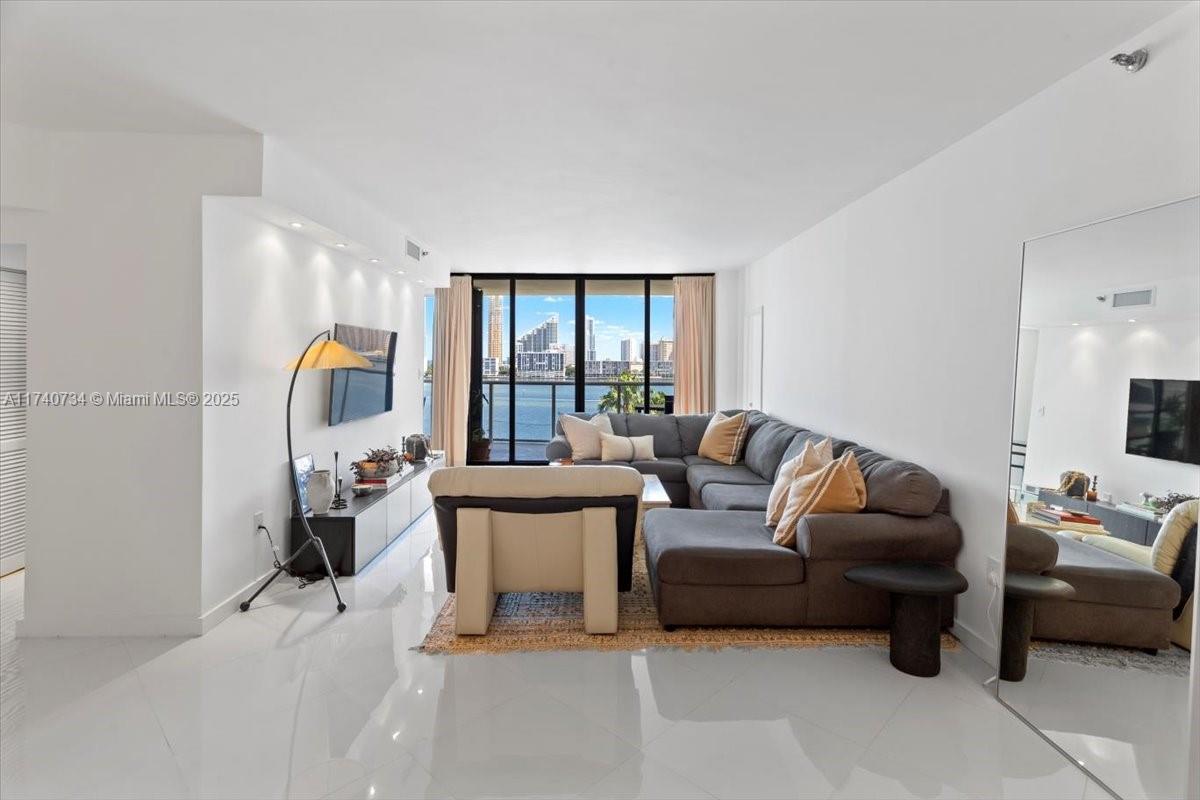 Panoramic water views and stunning sunrises fill every room of this meticulously updated 2 bed, 2 bath split-plan condo. Exciting enhancements are coming to 4000 Island Blvd, with renowned designer Jeff Howard leading a full transformation. New driveways, an elegant porte-cochère, fountains, and modern signage will elevate the sense of arrival. Residents enjoy abundant amenities: 15 tennis courts, 4 pickleball courts, 2 exquisite restaurants, a resort-style pool with poolside service, a world-class spa, indoor pool, elite fitness center, playground, private marina, dog park, and courtesy bus. Glass balconies and a prime location near the Island Club enhance this rare offering.