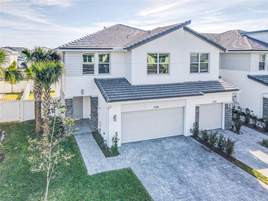 Veleiros is a new master-planned gated community in Deerfield Beach, located near luxury dining and shopping. This beautiful Bussola Model with 3 bedrooms and 2.5 bath, 2 car garage corner unit is a two-story, 1,832 sqft Smart Home open-plan kitchen overlooking a massive great room running the full width of the home. This wide-open configuration is perfect for family time or entertaining. Upstairs, you will find a corner owner's suite with his and hers sinks, large shower and a generous walk-in closet/dressing room integrated into the bath area, for total privacy. The stunning clubhouse has an oversized pool, state-of-art fitness center with aerobics room and kids' room and a brand new tot. Living at Veleiros is a permanent staycation!