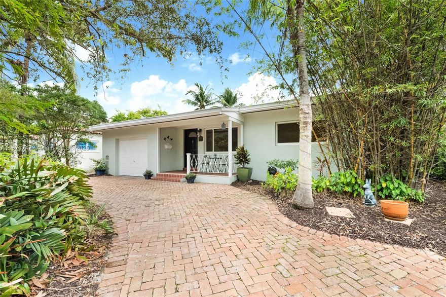 Don't judge a book by its cover - looks small but is HUGE! Impeccably maintained 3BR/2BA home on nearly 7,000 SF lot with lush landscaping, welcoming front porch, and private brick-paved circular drive. Totaling 2,428 SF, this gem features a split plan with an expansive 800 SF master suite (2010 addition) offering walk-in closets and a spa-like bath. Enjoy wood and ceramic floors, impact windows/doors, updated roof & water heater, plus a 1-car garage. The wood kitchen shines with granite counters & SS appliances. Relax on the screened patio surrounded by greenery. Freshly painted and move-in ready—this pristine home blends charm, comfort, and modern updates. A true "must-see"! Easy to show!