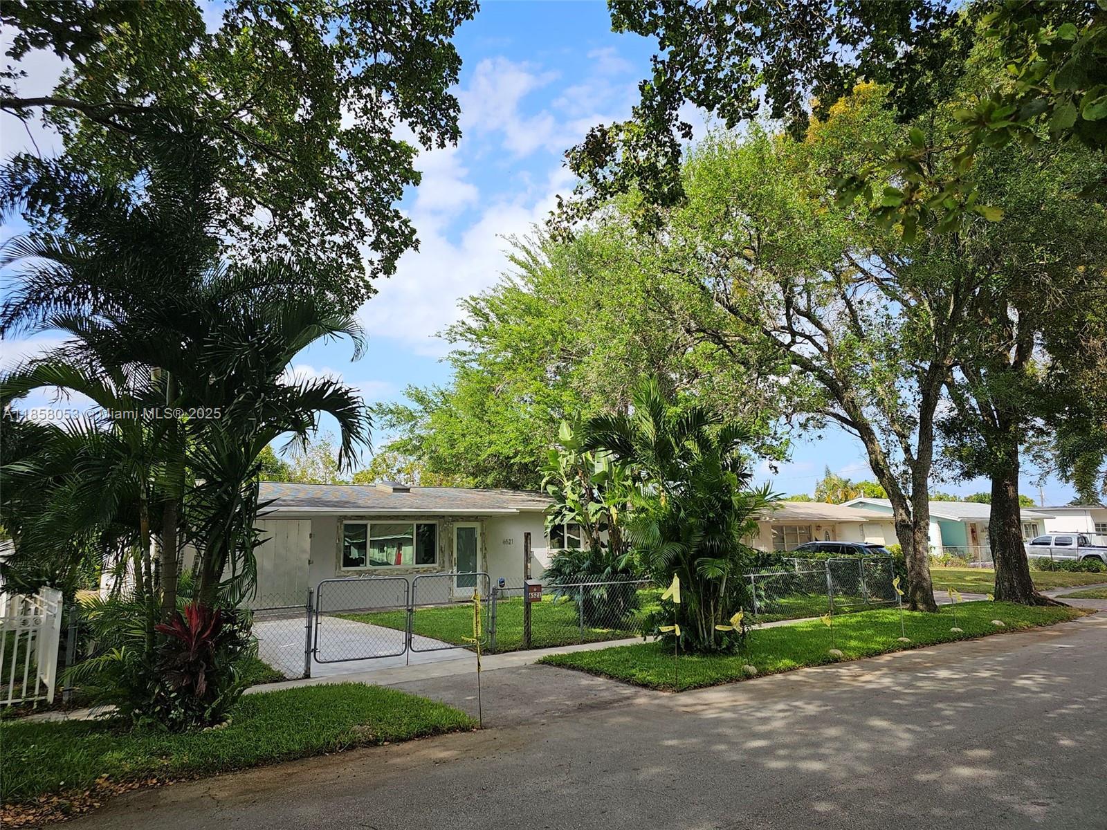 For sale is an extremely maintained and totally upgraded 2/1 single family home nested in a quite street and surrounded by majestic oak and other trees including an avocado tree and a small mango tree. It is completely fenced and sits in an ample 6200 SF lot and provides about 1200 SF of living space. It includes 1 car garage and a laundry room. Additionally it includes a 10X20 double insulated Ted's shed that sits on a concrete slab and can serve as a storage space, that also can easily be converted to work area, gym, hobby room, etc, etc. This house features brand new or newer: roof with lifetime warranty, porcelain tiles through out, hurricane / storm windows and doors (the best company), a tank-less water heater, four mini split units (A/C and heat), three skylights,