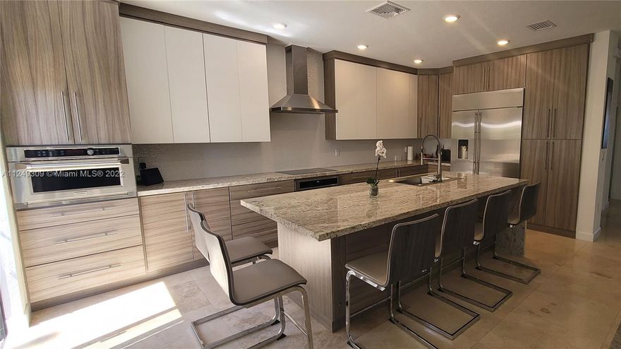Great location! New construction in gated community, lakefront 4bd/3.5 baths corner unit. Open concept SMART townhome. Upgraded custom kitchen w/state of the art Monogram appl., luxury granite countertop, Travertine stone floors & travertine pavers in patio. Powder room w/lighted quartz top. Luxury vinyl wood floors on second floor. Remodeled garage & customized as an office w/custom cabinetry, vinyl wood flooring and mini split unit. Camera security system. Ring camera doorbell. Spacious master bedroom with mini split, and custom closet. Room 2 has a wide window with lake views . Stair balcony has modern custom-made glass railing. Smart light switches in all main rooms. Enlarged laundry room in 2nd floor, with latest LG washer/dryer. Community has a brand-new clubhouse.