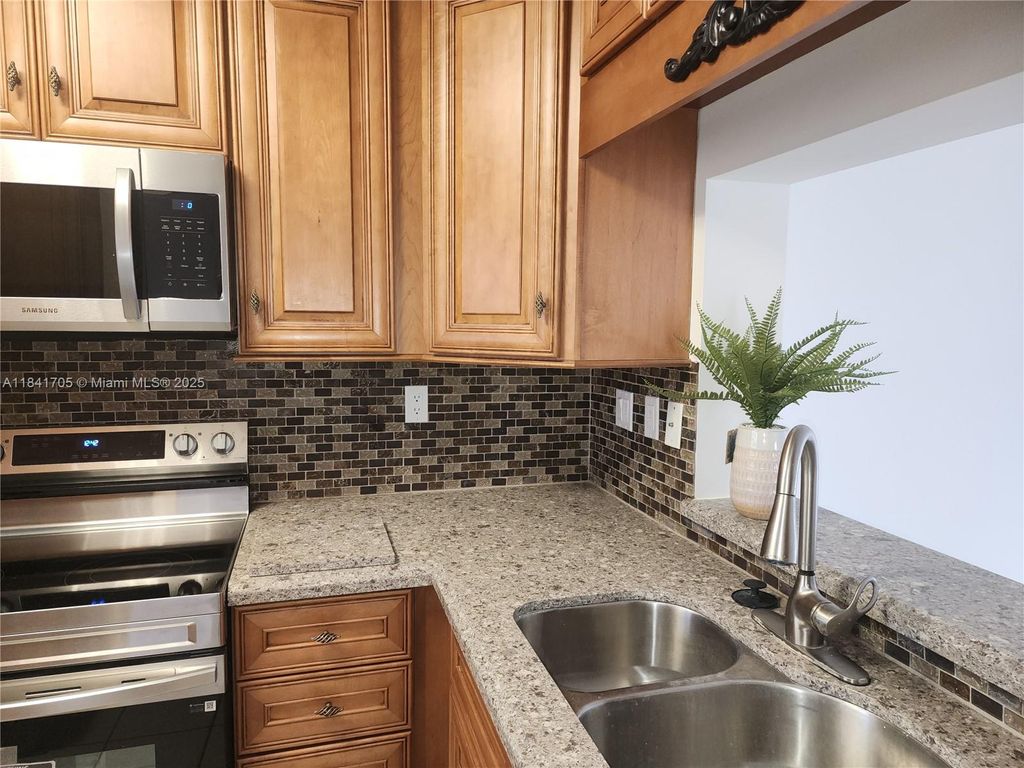 Photo of 1900 Sabal Palm Dr #305, Davie, FL 33324 (MLS # A11841705)