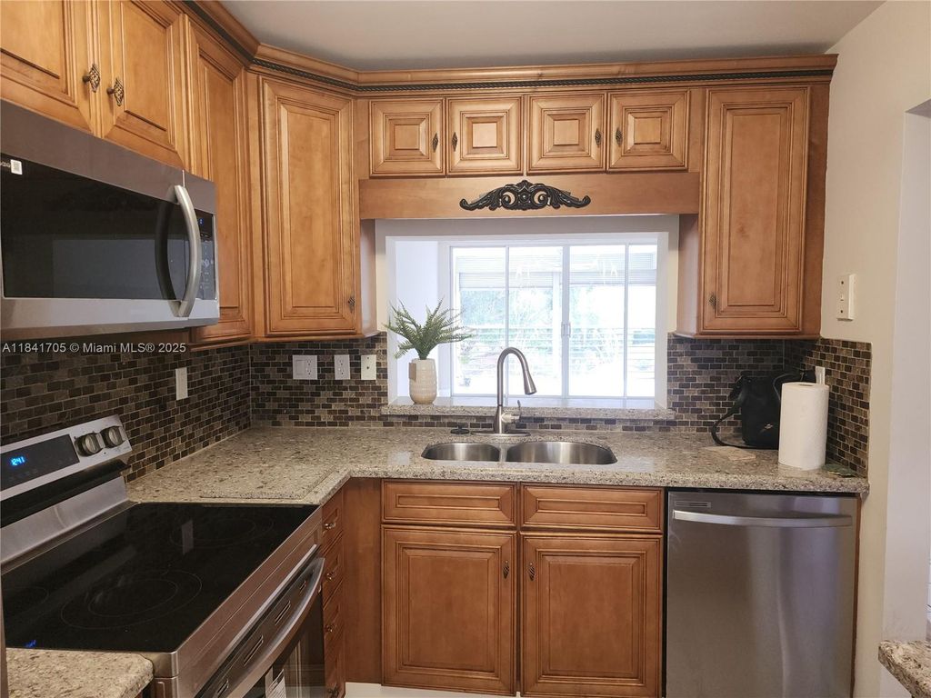 Photo of 1900 Sabal Palm Dr #305, Davie, FL 33324 (MLS # A11841705)