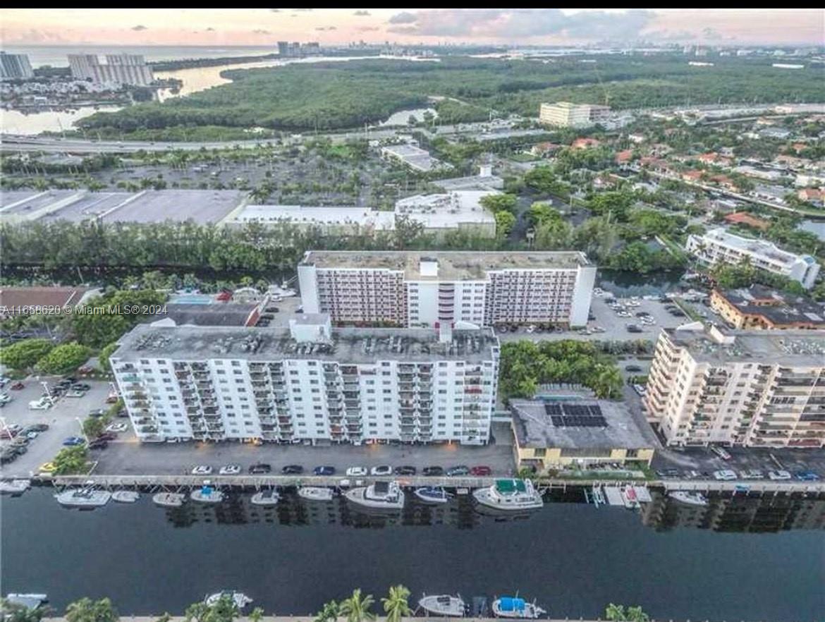 Experience breathtaking views of the intercostal waterway from every room of this stunning luxury penthouse floor. Corner unit with private wrap-around balcony. Every room has been fully renovated, featuring beautiful flooring throughout. Unit was Converted from a three-bedroom to a two bedroom unit that offers an expansive living area. The kitchen seamlessly opens to the living and dining area. Granite countertops grace the eat-in kitchen, adding a touch of elegance. Primary bedroom features two closets, including a spacious walk-in closet.The location is prime, offering convenient access to local amenities; theatre, stores, restaurants and a 5 minute drive or a 20-minute walk will take you to the beach! Condo amenities, include heated pool, sauna, conference & piano room and library