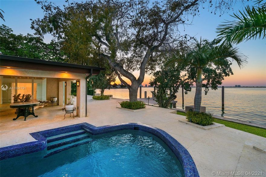 This Bayfront home is perfectly located on the coveted tip of the Venetian Islands. The 5BR/5BA home sits on a 13,382 SF lot w/open Biscayne Bay & stunning sunset views. Over 4,800 interior SF, wide plank tan oak & custom Cuban tile floors, high wood-beamed ceilings, sky lights & an interior courtyard. Spacious living room w/fireplace & wet bar, family room w/full BA, & dining room all w/large windows & water views. Gourmet kitchen sports top-of-the-line Wolf & Samsung appliances, granite center island, eat-in seating & adjacent family area to relax. Bay facing principal suite offers direct terrace access, voluminous walk-in closet & elegant principal bathroom w/walk-in glass shower & pedestal soaking tub. Large pool, deck w/covered seating area, large dock, direct bay & Ocean access.