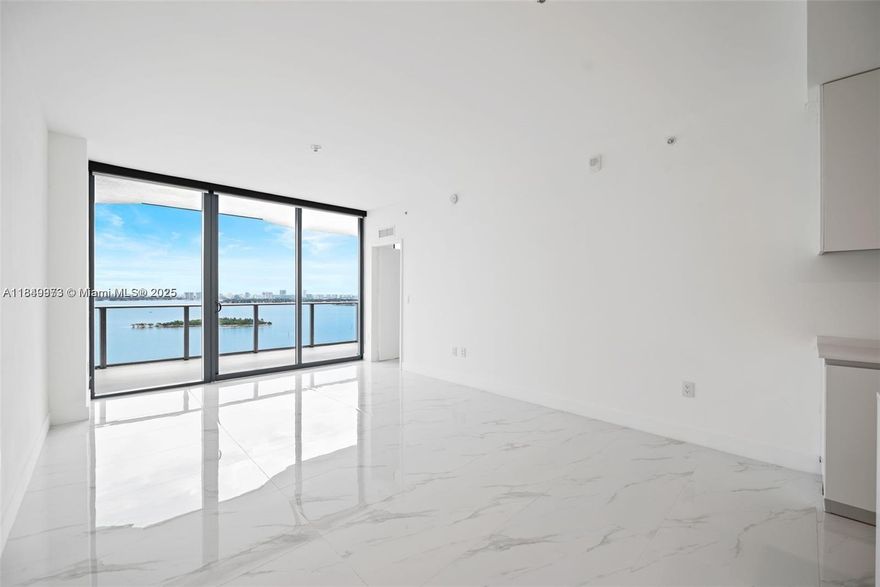 Stunning NEW BUILD 1 bedroom + den, 2 bath condo in luxurious Aria Reserve, in the popular Edgewater neighborhood! New ceiling light fixtures and shades just installed! BRAND NEW, be the 1st to live in this home!! Modern designer finishes, elegant marble styled porcelain floors, spacious island, premium appliances, and windows that flood in natural light. Den is perfect for an office or bedroom. Step onto the expansive private balcony with breathtaking views of Biscayne Bay - perfect for a morning coffee while watching the sunrise. Enjoy access to world-class amenities including resort-style pool, a full-service spa, fitness center, tennis courts, 24-hour concierge, and a waterfront promenade. Minutes from Wynwood, Brickell, Downtown, & Miami Beach, this home offers luxury and convenience!