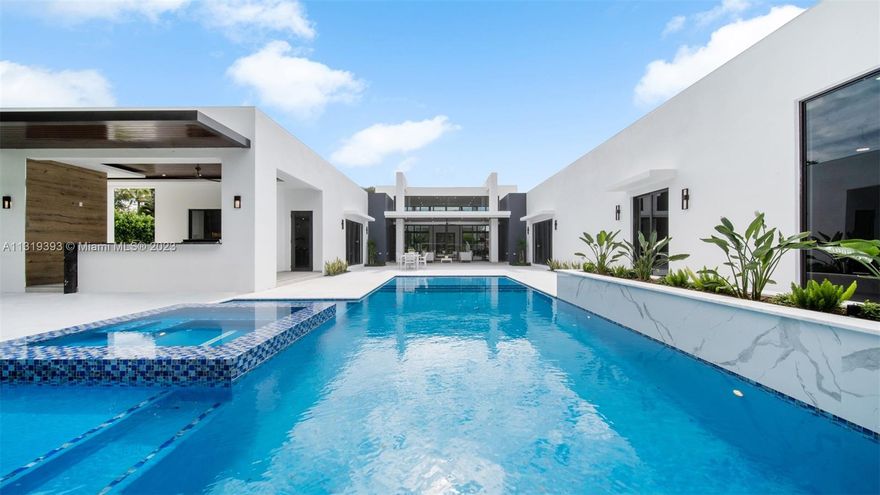 Exquisite modern new construction built among stately palms and mature oak trees on a quiet cul-de-sac.  Featuring 5 bedrooms, 6 1/2 bathrooms, Italian porcelain floors and walls of glass offering picturesque views of the 40,075 SF estate. Chefs Kitchen with custom cabinetry, gorgeous 10' x 6' marble island, designer pendants and Thermador appliances. Main Bedroom Suite includes a large walk-in closet with stone topped island and gorgeous glass pendants. Relax in the Spa Bathroom with soaking tub, rain shower and refrigerator. Experience the ultimate South Florida lifestyle lounging around the 38' pool with spa and 3 beaches. Cooks will love the Summer Kitchen  with stainless steel grill, double gas burner, ice maker and refrigerator. Completion estimated January 15, 2023. 
1/15/2023.