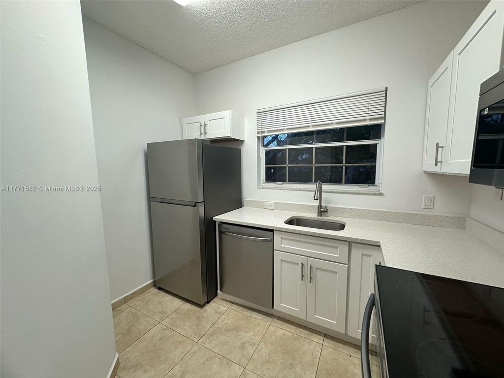 Photo of 800 Cypress Park Way #D1, Deerfield Beach, FL 33064 (MLS # A11771582)