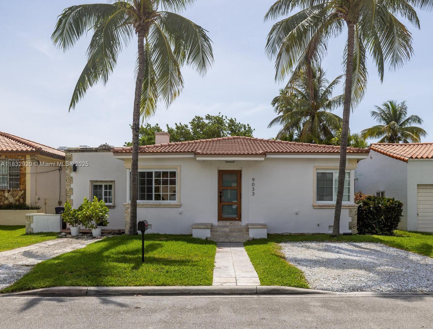 Welcome to Casa Coral! In the heart of Surfside and just 4 blocks from the ocean, this spacious, bright and updated 3bed/3bath home has been lovingly maintained and offers a great blend of original details and modern finishes. Enter into the extra-large sun-drenched living room with refinished wood floors and charming fireplace. Updated kitchen with new refrigerator and breakfast bar is open to the large dining area. Adjacent quarry-tiled sunroom features doors to the back pergola-covered deck and fenced-in gardens with room for a pool. Two of the three spacious bedrooms feature en-suite baths, including the bright main suite retreat with ample closet space. All hurricane windows-doors, newer A/C, plus a perfectly appointed laundry room with newer washer & dryer and tons of storage!