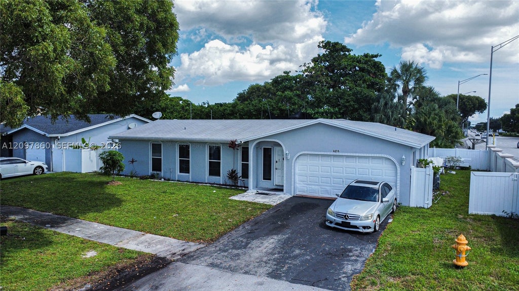 Photo of 5600 NW 57th Way, Tamarac, FL 33319 (MLS # A12097860)