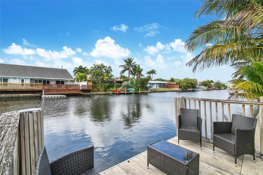 Exceptional waterfront, corner-lot single-family home in Wilton Manors featuring 2,023 square feet of living space. This property offers 3 bedrooms, 2 bathrooms, and an additional room making it a 4/2. The open kitchen concept complements the split bedroom layout, while the backyard evokes a serene tropical oasis. The home boasts terrazzo flooring throughout, indoor laundry facilities, and a double car garage with extra storage space. Situated in a prime location, this property is a must-have. Seize the opportunity to make it yours.