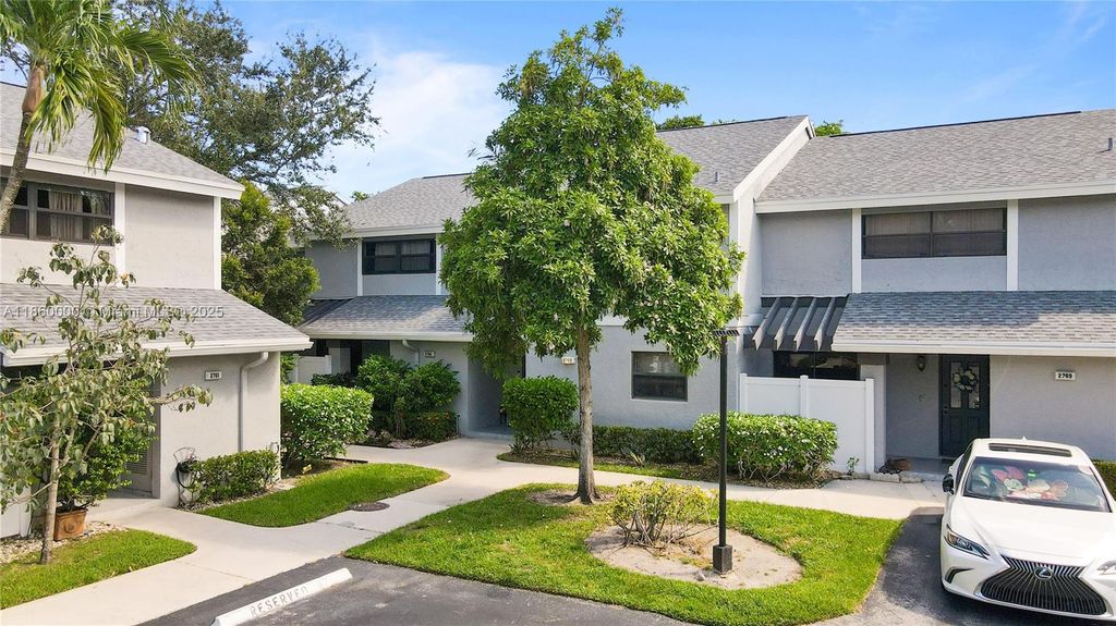 Photo of 2767 NW 42nd Ave #2767, Coconut Creek, FL 33066 (MLS # A11860000)