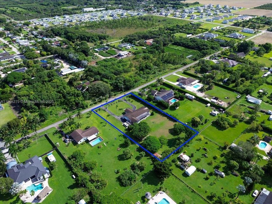 Spacious 3-bed, 2.5-bath single-story home in Redland with office/extra room that can serve as a 4th bedroom. Set on a fully fenced 1.19-acre lot, this home offers 2,853 SF under air, formal living and dining rooms, a split floor plan, and a 2-car garage with a Port de Cachet. Interior features include vinyl and tile flooring throughout. Enjoy outdoor living with a covered patio and ample space for a pool, boat, or RV parking. The large lot offers endless possibilities for expanding or building additional structures. No HOA or CDD and located in a peaceful area with plenty of privacy. Don’t miss this opportunity to own a Redland gem with room to grow!