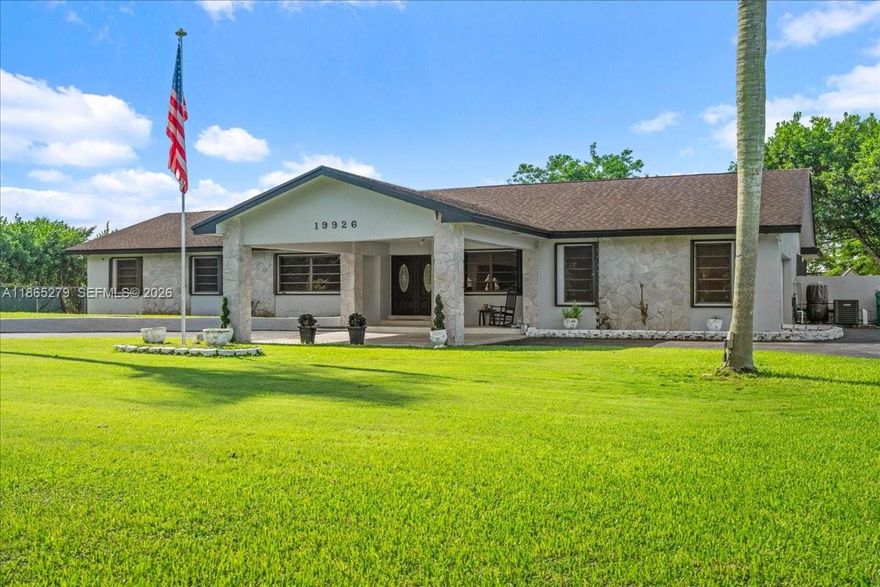 Over an acre in the heart of Redland with no HOA and the space and freedom rarely found at this price point. This 3-bedroom, 2.5-bath ranch-style home sits on 1.19 acres with a 50x12 covered porch, fruit trees, a fenced yard, and room to add a pool, park an RV or boat, and still have space left over. Newer luxury vinyl floors throughout give the home a fresh, modern feel from the moment you walk in. The split bedroom layout offers privacy, with a primary suite, formal living and dining rooms, a den or office that can easily serve as a 4th bedroom, and a spacious family room that opens to the porch. Attached 2-car garage with Port de Cachet. Storm ready with accordion shutters throughout and a home generator so you never lose power when it matters most. Well and septic means no water or sewer bills. No HOA & no CDD. Buyer to verify all uses, restrictions, and zoning with Miami-Dade County. Please review all disclosures in MLS attachments prior to submitting an offer.