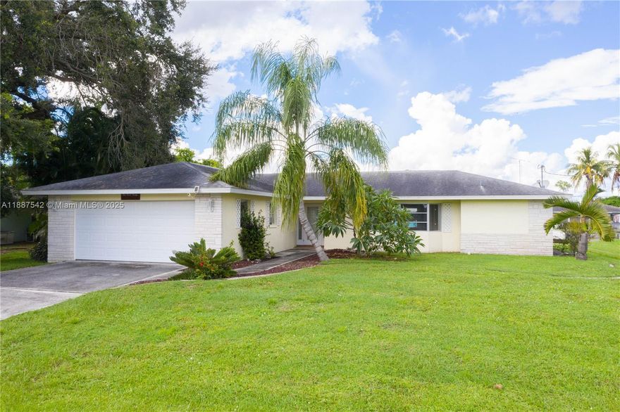 Experience the best of waterfront living with this concrete block home offering direct sailboat access. Built for peace of mind, it sustained no flood damage during recent hurricanes. Inside, enjoy an open floor plan with tile flooring, a granite kitchen with island, and white panel cabinets. Accordion shutters provide storm protection, while an oversized garage and enclosed Florida room offer extra storage or potential closet space. The backyard is perfect for entertaining, with room for a pool, a concrete pad for a shed, and a boathouse featuring an 8,000 lb lift plus workshop with power and water. Fresh exterior paint in 2022. Connected to central water/sewer and just minutes from I-75, this home blends waterfront serenity with everyday convenience.