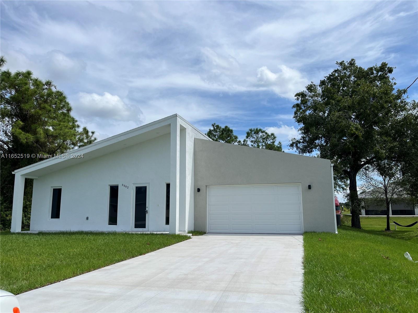 INVESTORS-BUYER NEEDS TO HONOR LEASE Luxury Modern House, 18' high ceilings. Different from other constructions, the internal walls of the house are built with blocks and concrete, which gives extra resistance, also blocks the sounds between rooms. there's no attic, therefore it does not accumulate heat and helps keep the house cool for longer. High end threaded wood beams throughout for termites. Enjoy Florida Weather with the big lanai in the back of the house. Stainless steel appliances. The design intent is to have modern minimal style, (Image Disclaimer - renderings are shown for illustration purposes only. Digital representation of color may vary from the actual product. Bring your boat/RV -pictures of model house