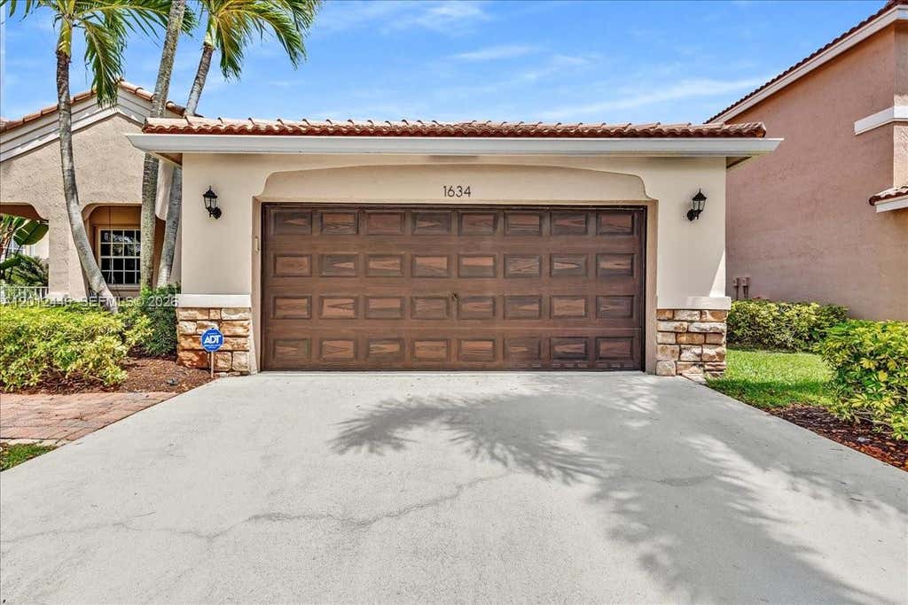 Photo of 1634 Sandpiper Cir, Weston, FL 33327 (MLS # A12012446)