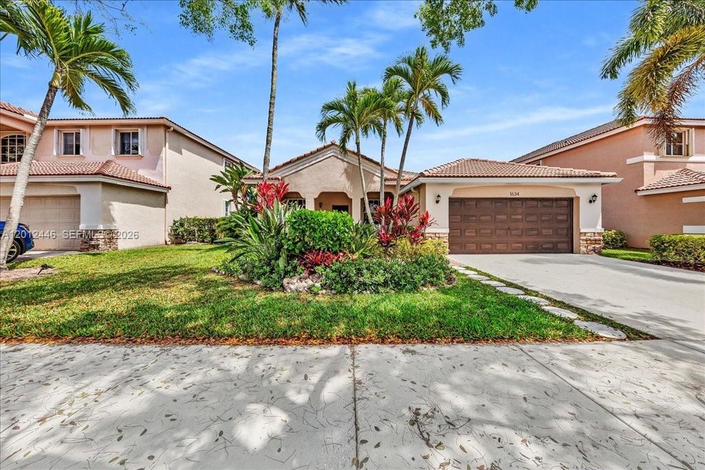 Photo of 1634 Sandpiper Cir, Weston, FL 33327 (MLS # A12012446)