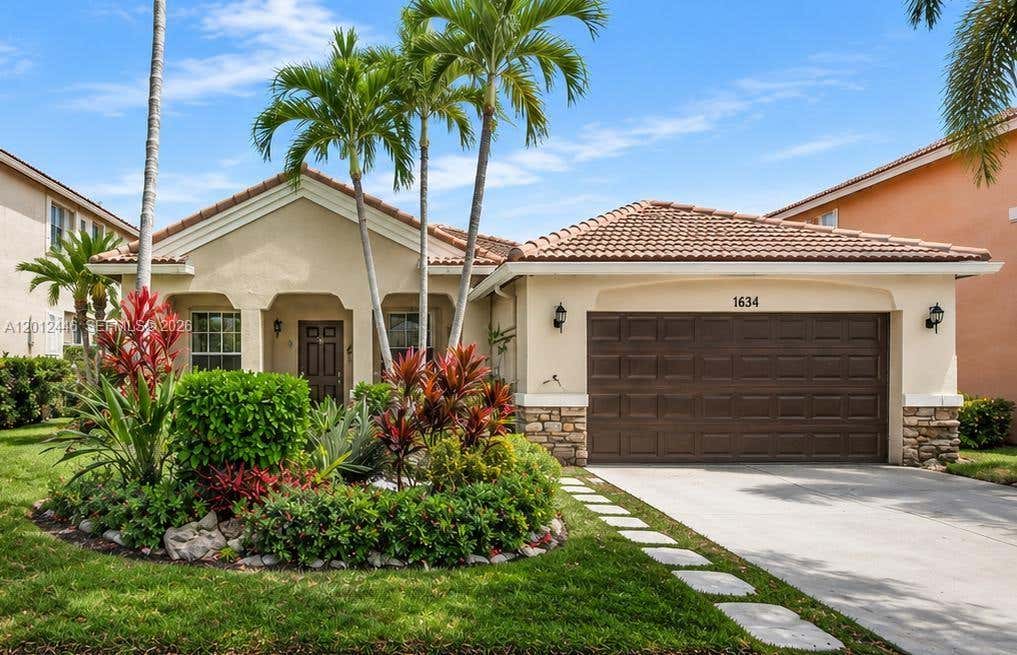 Photo of 1634 Sandpiper Cir, Weston, FL 33327 (MLS # A12012446)
