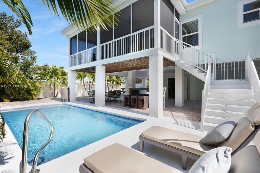 Turnkey Investment Opportunity located just 0.3 miles from Sombrero Beach, perfectly positioned for strong guest demand. Grossing an impressive $135,000 in rental income in 2025, this fully furnished property comes with rental management already in place- making it easy for a new owner to step in and start earning immediately! Enjoy the best of Keys living with a heated pool, lush private fenced yard and multiple porches including screened spaces for seamless indoor-outdoor living. Inside, the open-concept layout features abundant natural light and a modern kitchen ideal for entertaining. Built with impact windows and doors and durable Hardie board siding, plus covered parking and storage below, this home is as functional as it is inviting. Now's your chance to own an income-producing beach home in Marathon!