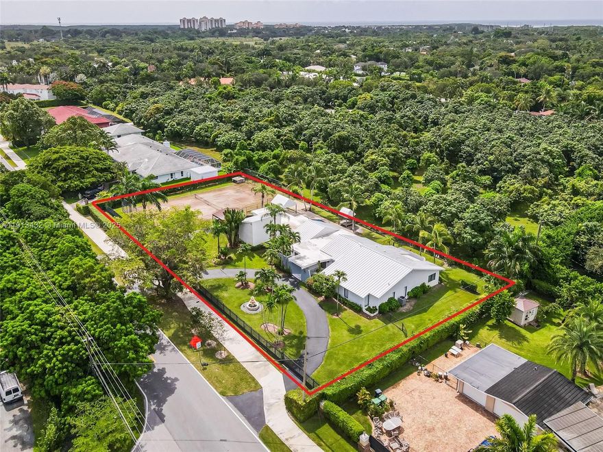 Step into a haven of comfort & luxury with this beautifully designed, move-in-ready single-story pool home. Featuring 5 bedrooms, 4 bathrooms, & a 2-car garage, this residence blends elegance with everyday functionality. The chef’s kitchen stands at the center of the home, showcasing dual islands that combine style & practicality. Sunlight fills the interiors, creating a warm, inviting atmosphere. Enjoy true indoor-outdoor living host poolside gatherings, play tennis on the red clay court, or unwind on the covered terrace overlooking the lush yard. Conveniently located near top-rated schools, shopping, & dining. The private 1/1 guest quarters with its own poolside & side entry is ideal for guests, in-laws, or office use. Seller financing available, 20% down. Tenant-occupied through 12/31.