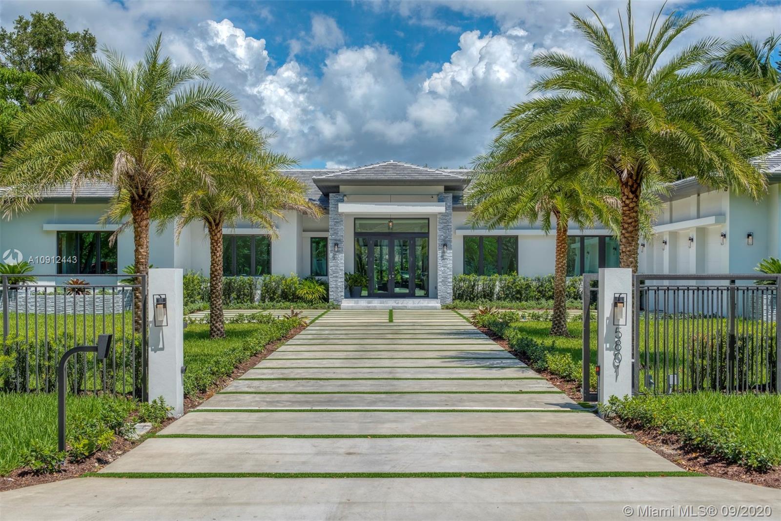 This beautiful brand new home has volume ceilings and open floor plan that  buyers are looking for. The home has 7 bedrooms and a den , plus a separate guest house with 7.5 baths. A beautiful modern ItalKraft kitchen with wolf and subzero appliances. The marble island is very large and wonderful for entertaining. The walk in pantry will truly impress! The master closet is the size of a bedroom. The backyard has 2 large covered terraces with and an expansive pool deck and a summer kitchen to enjoy. The large heated pool with spa is spectacular and has plenty of yard for the kids to run around! The detached guest house is adjacent to the summer kitchen and has many possibilities. Then home is fully fenced and gated and has a beautiful avocado and mango tree on the side. A great family home!