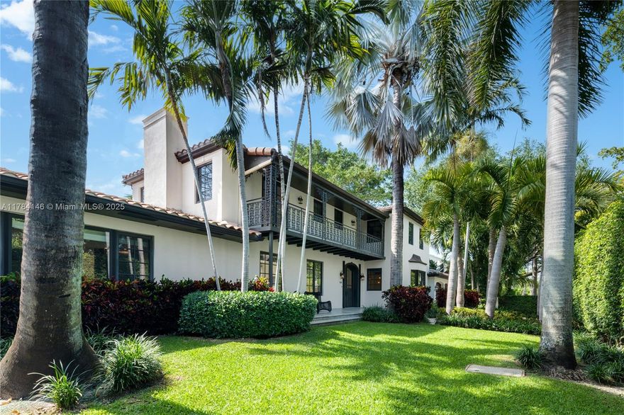 Timeless elegance meets modern comfort in this beautiful 4-bedroom, 4.5-bath two-story residence located on a corner lot in Miami’s exclusive Venetian Islands. Gated and surrounded by lush landscaping, this home offers privacy and charm with classic Mediterranean architecture. Inside, enjoy a light-filled living area, formal dining room, and chef’s kitchen with black stone counters and custom cabinetry. French doors open to a tropical backyard retreat with a sleek lap pool and lounge area—perfect for entertaining. Upstairs, the spacious primary suite features hardwood floors and garden views. A two-car garage and generous driveway provide ample parking. Minutes from Sunset Harbour, the Design District, and the beach.