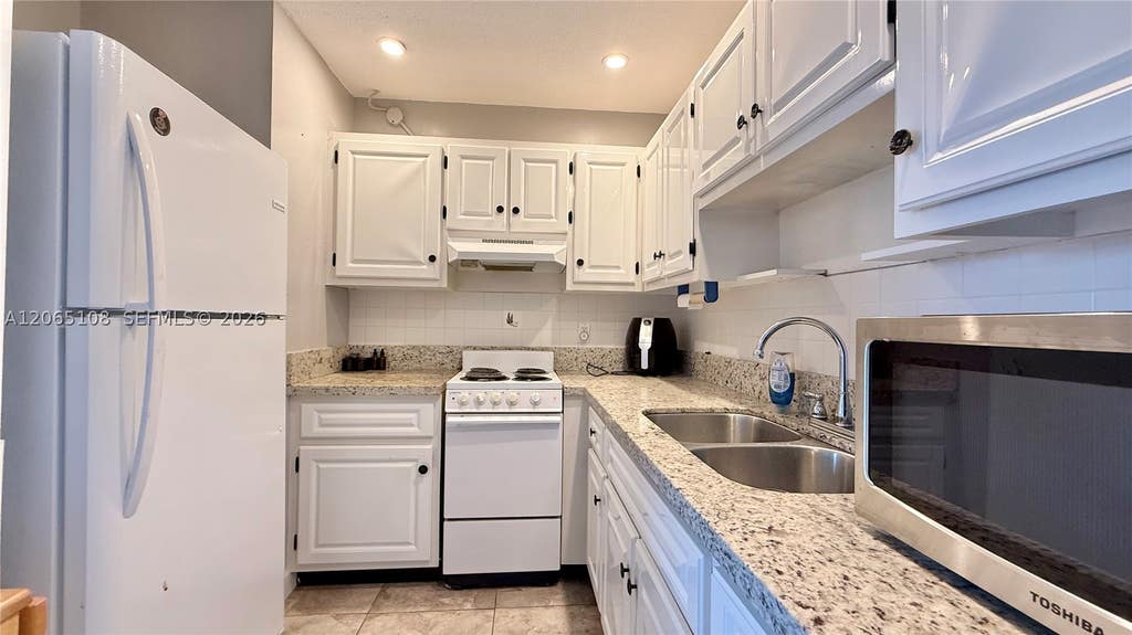 Photo of 22 SE 3rd Ter #31, Dania Beach, FL 33004 (MLS # A12065108)