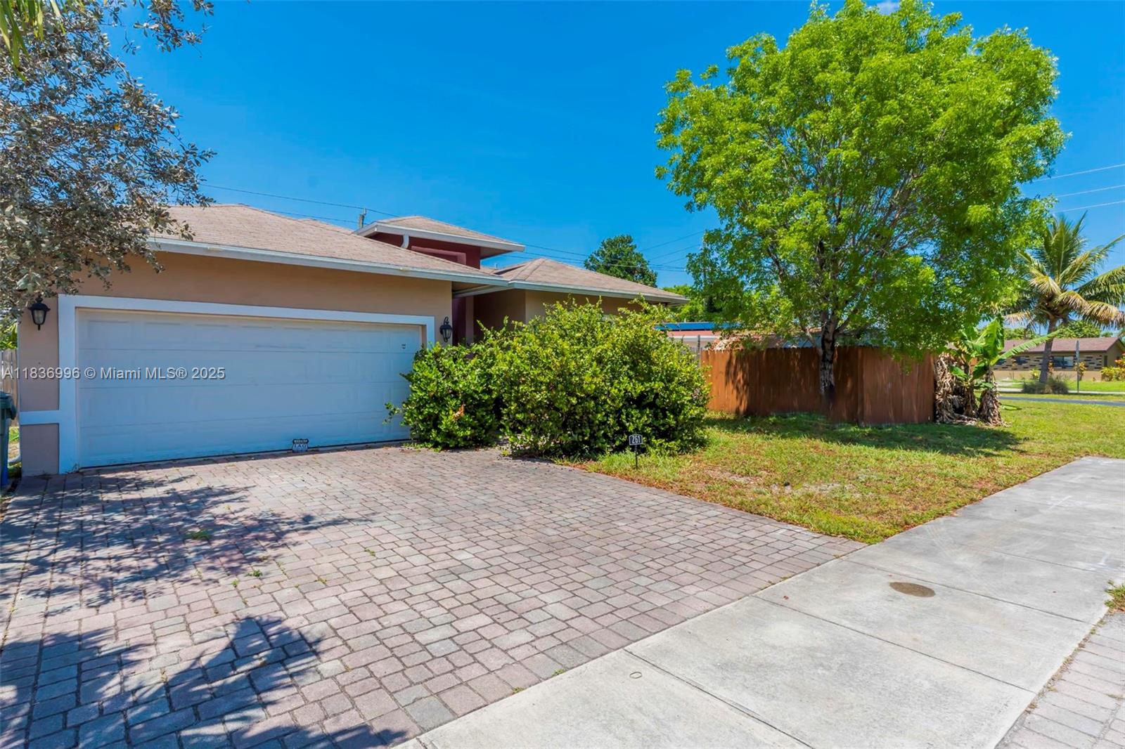 Absolutely stunning single-family home minutes from downtown Fort Lauderdale and the beach—no HOA! Features a bright open floor plan, LED recessed lighting, hurricane impact windows/doors, and lush tropical landscaping. Enjoy volume and tray ceilings, an eat-in kitchen with granite counters, 42" wood cabinets, S/S appliances, and a large breakfast bar. The primary suite offers a walk-in closet and dual-sink vanity. Includes a 2- car garage with storage, paver driveway, fenced yard, open patio, and shed. Walk to Wimberly Park. New AC 2023. Prime location near Las Olas, I-95, top schools, parks, dining, and shops.
