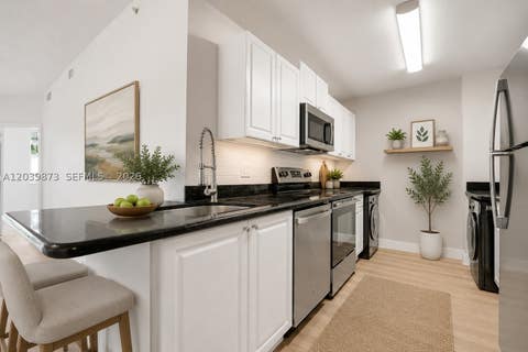 Photo of 2020 Greenview Shores Blvd #109, Wellington, FL 33414 (MLS # A12039873)