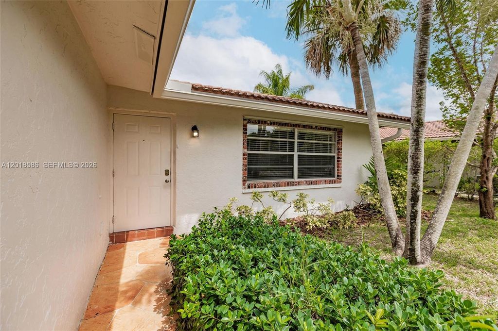 Photo of 827 NW 87th Ave, Coral Springs, FL 33071 (MLS # A12018586)
