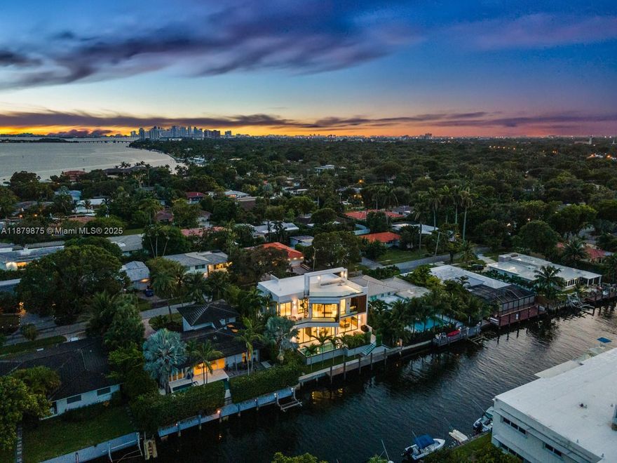Experience modern luxury in this 2025 NEW CONSTRUCTION waterfront estate designed by FAO Architecture, built by Barreto Constructions for Setasi Developers. Offering 6,621 Total SqFq, 4 beds, 4.5 baths, smart-home system, and Italian Mia Cucina kitchen. The master suite boasts water views, dual walk-ins, spa bath, and private balcony. Crafted with anti impact glass, floating staircase, wine cellar, and elegant Spanish tiles. Outdoor living features 75 ft waterfront with no fixed bridges, heated pool/spa, summer kitchen, an amazing ROOFTOP retreat for unforgettable sunsets over the Miami skyline,  spacious balconies, terraces and 2 cars garage.  Located in prestigious Miami Shores, minutes from elite schools, golf, and Bal Harbour Shops. Partially furnished, ready to move in.