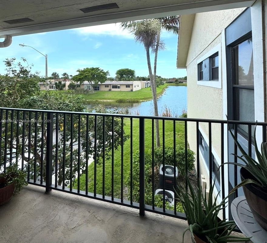 Beautiful second-floor, 2 bedrooms and 1 bathroom condo. Boasts modern features, kitchen and bathroom with granite countertops and stainless steel appliances. Entire unit features tile flooring. Enjoy the convenience of an in-unit washer and dryer and relax on your private balcony. The condo features spacious bedrooms filled with natural light from large windows, offering a bright and airy ambiance. Centrally located just minutes away from Okeechobee Rd, Turnpike, and 441. Benoist Farms Elementary is within walking distance, adding extra convenience for families. Investor-friendly community--can be rented on Day 1! With quick access to main roads and highways, this unit won't last long! Perfect for investors or homeowners alike. Don't miss the chance to call this place home!`