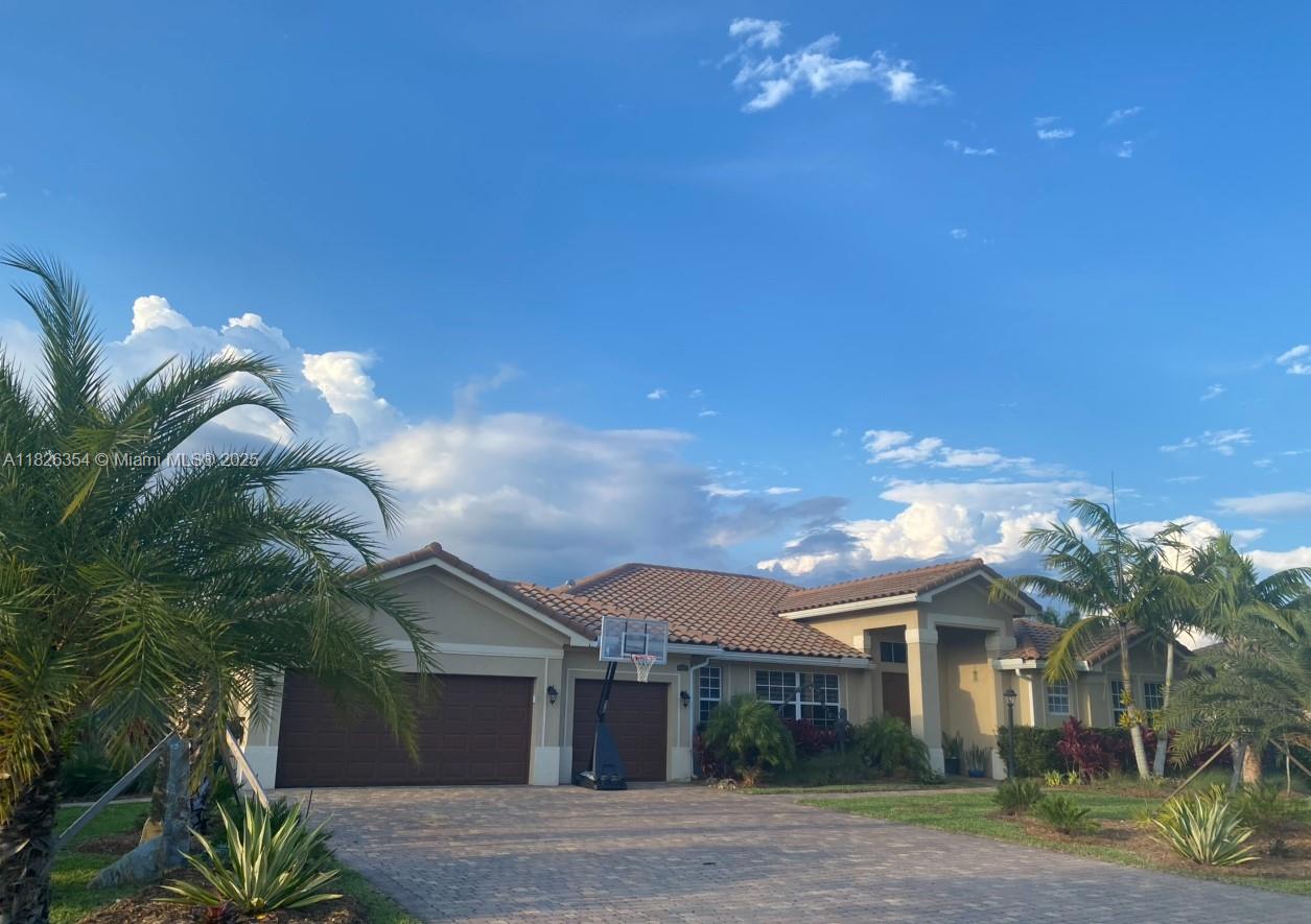 Everything you have been dreaming of in a rental home & sooo much more. This gorgeous 4/3.5 pool home on a 1/2 acre in sought after Redland Reef will not last. This home includes a 3 car gargage, 2 paver driverways for multiple cars, spacious backyard w/ privacy fence & tropical landscaping, adding to the lush feel of this beautiful property. Tile throughout w/ netural paint colors & custom window blinds. Formal living, dinning & family rooms, large eat-in kitchen & views to the fabulous pool. The over-sized master has an add'l flex space that is being used as a home office w/ a door to the exterior. There are 2 large walk-in closets & a grand ensuite. The back patio is covered & there is ample space to entertain. Owner intends to include lawn/pool care. Contact listing agent for details.