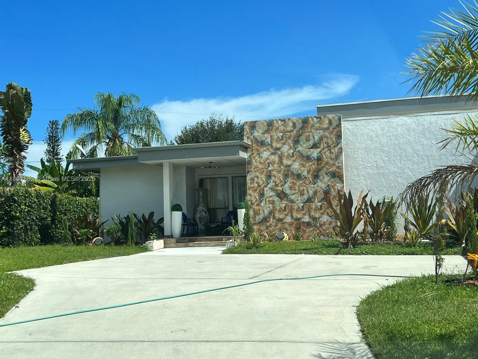 This one-of-a-kind Single story home backs to the 1st hole of Palm Beach National Golf Course. 5088 Total square
feet! Living space boasts a Detached Master Suite w/access to pool & Golf Course. Main house has a Designated
wing w/ 2 Bedrooms & Cabana Bath-all offering access to private Pool deck! This house has endless options! Great living space includes an Open Kitchen w/ Corian counters, Cook Top, Double Oven & walk-in Pantry (w/110 plug).Additional features include Billiard rm w/ Wet Bar, 2 Office spaces, Library, Family rm, Living Rm, Formal Dining Rm, Laundry Rm. Hurricane Protection includes Accordion Shutters & Aluminum Panel. 4 AC units, 2 Water Heaters (1 from 2014)+Tankless water heater. Washer & Dryer hookup. Garage spaces for landlord use.