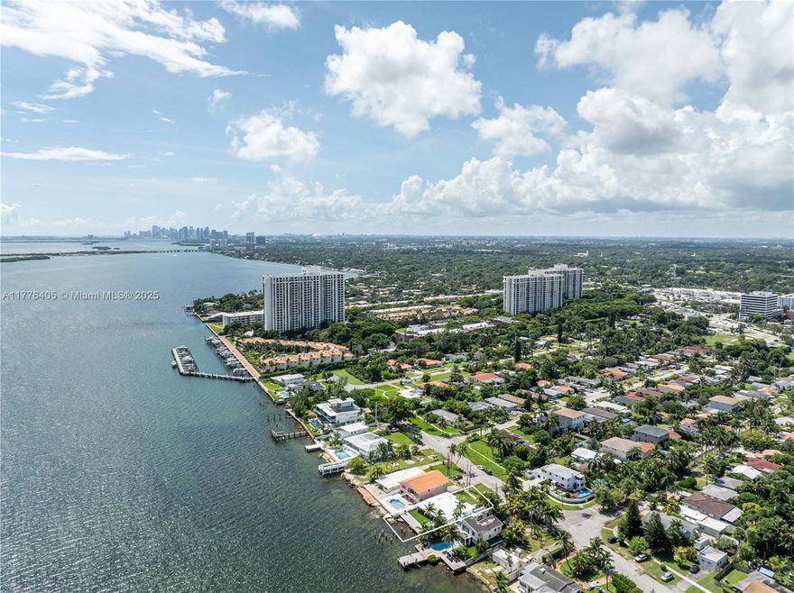 Prepare to be captivated by breathtaking, unobstructed views of Biscayne Bay from this beautifully updated
residence in the heart of Biscayne Shores. From the moment you step inside, the expansive open living spaces
draw your eyes straight to the mesmerizing panoramic bay views. Centrally located just 15 min. from Surfside &
Bal Harbour beaches this home blends serene waterfront living with unbeatable location. Also just minutes from
the Design District, MIA, Miami Shores Golf & Country Club, as well as a variety of grocery stores and dining
options. The 3BR/3BA main home is thoughtfully designed with an airy, open-concept. An attached 1BR/1BA guest
suite with a private entrance provides the ideal setup for guests or live-in accommodations. 68 feet of waterfront
ready to build dock.