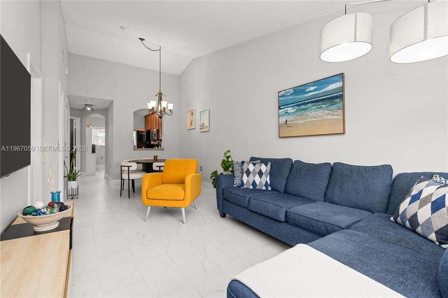 Welcome to this spacious move-in ready condo offering the perfect blend of comfort and convenience. This bright and airy unit features an open-concept layout, generous living and dining areas. This 2 bedroom 2 bath condo is located on the second floor and it features vaulted ceilings, porcelain tile, tastefully remodeled bathrooms, and impact windows. The kitchen is equipped with a new dishwasher, microwave, refrigerator, and a newer washer/dryer. Located in a well-maintained community with amenities such as pool and a play area for kids. Conveniently situated near shopping, dining, major highways, and top-rated schools. This condo is a must-see!