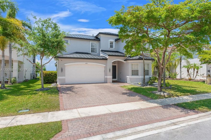 Set within Sunset Falls, this thoughtfully cared for 5-bedroom, 4-bath residence offers true move-in readiness and waterfront living, designed for space, flow, and everyday function. The first-floor features porcelain tile throughout and recessed lighting, creating a bright, modern feel, along with a full bedroom and bath and convenient under-stair storage.
The kitchen is equipped with stainless steel appliances along with newly installed quartz countertops, delivering a clean, elevated finish at the heart of the home. Upstairs, engineered wood flooring carries from the staircase and extends throughout, adding warmth and continuity, complemented by a versatile loft that adapts to your lifestyle. Secondary bedrooms share a Jack-and-Jill bath, while a second-floor laundry room with utility sink enhances daily convenience.
Significant upgrades include a metal roof, impact front door with smart film technology, impact sliding glass door, updated AC & air handler, water heater, and newly installed gutters. Step outside to a backyard overlooking a tranquil lake with unobstructed sunset views, creating a peaceful outdoor retreat. A two-car garage with epoxy flooring completes the home with a clean finished touch.
Residents enjoy resort-style amenities including a pool, tennis and pickleball courts, a basketball court, fitness center, children's park, indoor social room for gatherings, lakeside gazebo, and 24/7 guard-gated security.