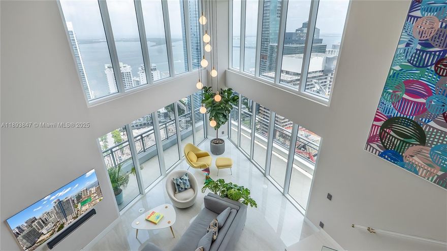 Experience elevated living in this highly remodeled 2-story duplex residence soaring 42 floors above the city at Infinity Brickell. Perched on the SE corner, this sky villa showcases sweeping views of the Bay, Ocean, & South Brickell. Step inside and be greeted by dramatic double-height ceilings and floor-to-ceiling glass walls that blur the line between indoors and sky. Reimagined with modern flawless design, this home features a custom LED-lit floating staircase, designer textured walls & wallpaper, a full marble-slab kitchen backsplash, smart electronic shades with upgraded lighting throughout. Infinity Brickell provides resort-style amenities, including pool, fitness center, spa, valet, & 24-hour security—all just steps from Brickell City Centre, top restaurants, and vibrant nightlife
