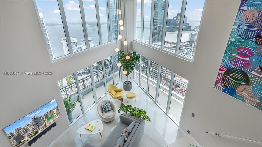 Experience sky-high living in this exquisitely remodeled 2-story duplex soaring above Brickell on the 42nd floor. Perched on the coveted SE corner, this sky villa delivers Bay, & South Brickell views through dramatic double-height glass walls that blur the boundary between indoors & sky. Reimagined with flawless modern design, it features a custom LED-lit floating staircase, designer textured walls & wallpaper, smart electronic shades, marble baths & marble-slab kitchen backsplash. Stunningly finished with upgraded automated lighting for a contemporary feel. Infinity Brickell offers resort-style living with pool, spa, fitness center, valet, 24/7 security, & exclusive rooftop access for floors 40+ — all steps from Brickell City Centre’s world-class dining, shopping, and entertainment.