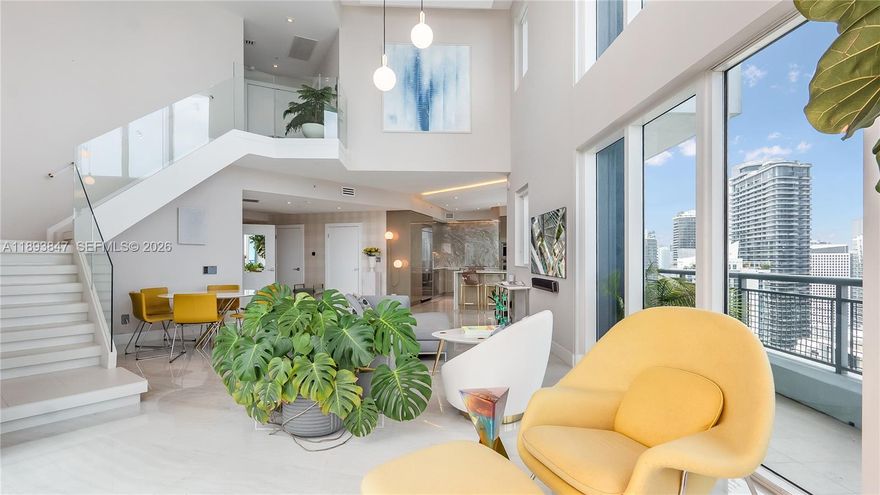 Experience sky-high living in this exquisitely remodeled 2-story duplex soaring above Brickell on the 42nd floor. Perched on the coveted SE corner, this sky villa delivers Bay, & South Brickell views through dramatic double-height glass walls that blur the boundary between indoors & sky. Reimagined with flawless modern design, it features a custom LED-lit floating staircase, designer textured walls & wallpaper, smart electronic shades, marble baths & marble-slab kitchen backsplash. Stunningly finished with upgraded automated lighting for a contemporary feel. Infinity Brickell offers resort-style living with pool, spa, fitness center, valet, 24/7 security, & exclusive rooftop access for floors 40+ — all steps from Brickell City Centre’s world-class dining, shopping, and entertainment.