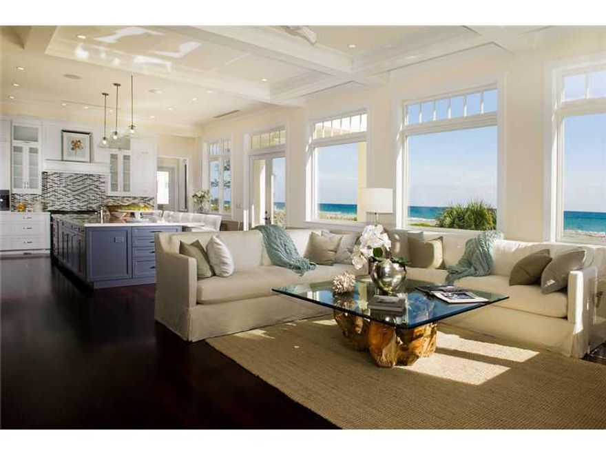 Capture the ocean, sand & sky through rows of beautiful oversized framed windows in this British West Indies-inspired beachfront estate. 5,555+ sqft with an elevator, 5 beds, 5.5 baths, spacious master suite with large sitting room and an additional guest  master suite on the first level. Open floor plan stretching across 101+ ft of prime oceanfront, the outdoor entertainment area features a magnificent private pool with spacious deck and dining veranda served by a summer kitchen.