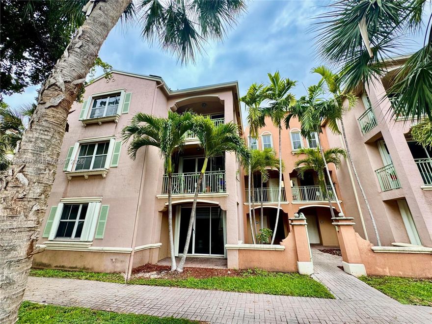 Great 3 Bed / 2 Bath condo in the desirable gated community of THE COURTS at Doral. This GROUND-FLOOR UNIT features an open layout with TILE flooring throughout the living areas and LAMINATED WOOD floors in the bedrooms, NO STAIRS and NO CARPET. Enjoy an open balcony and the convenience of an in-unit WASHER AND DRYER. A rare highlight in Doral: parking for up to 3 cars — 2 ASSIGNED PARKING SPACES plus 1 GUEST space (first come, first serve). The community offers a beautiful pool area and mature trees that provide great shade throughout the property. Excellent location. Must see!