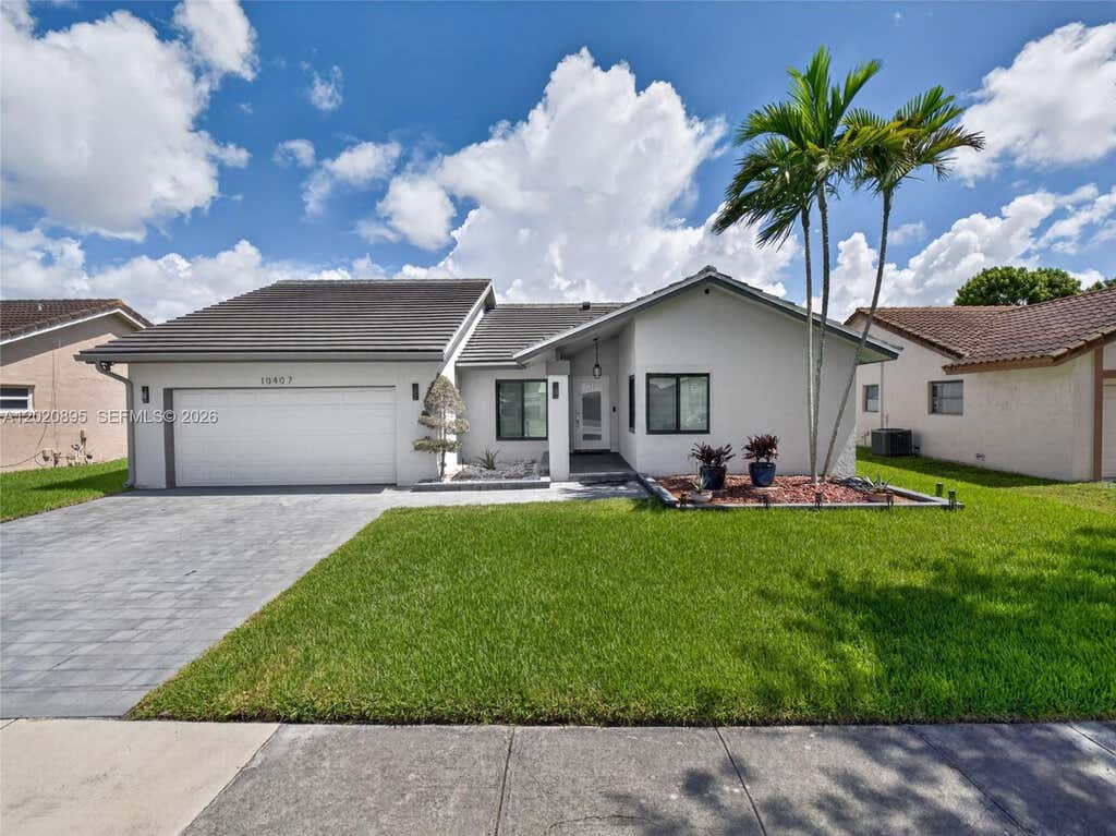 Photo of 10407 NW 5th St, Plantation, FL 33324 (MLS # A12020895)