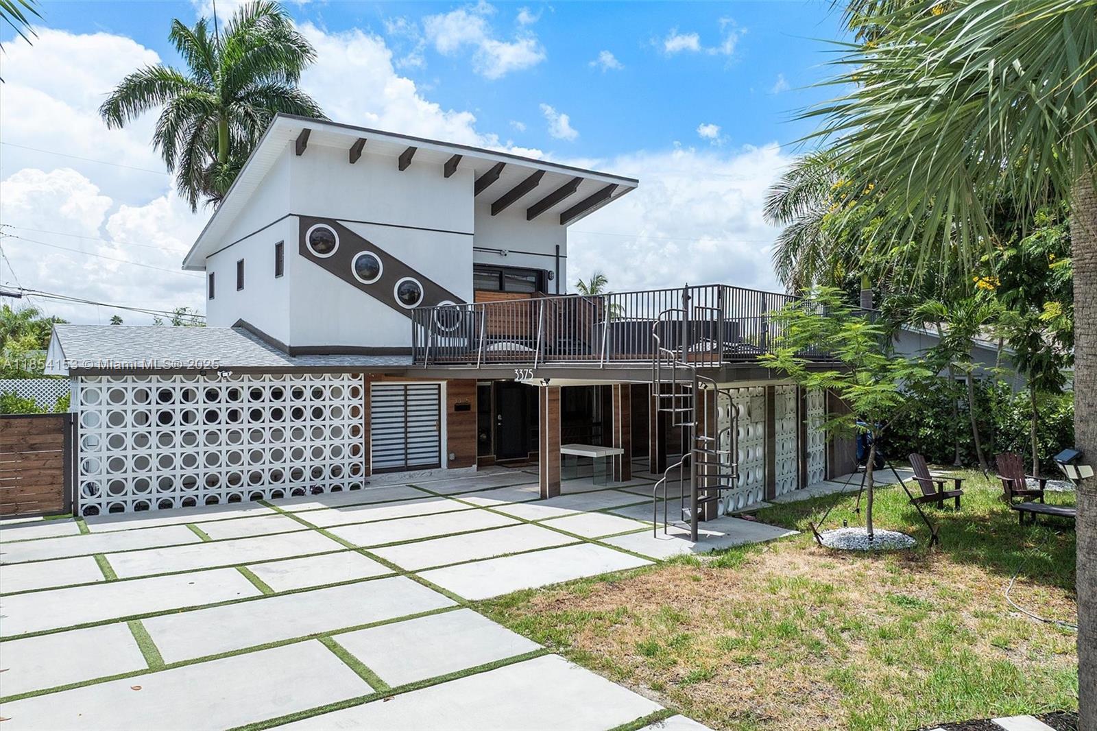 Located in the desirable Coral Woods neighborhood, this 2-bedroom, 2.5-bath home blends comfort and style with thoughtful updates throughout. The kitchen and bathrooms have been tastefully refreshed, offering a modern touch. Enjoy a low-maintenance turf yard, spacious deck, and a balcony patio perfect for relaxing or entertaining. The driveway provides ample parking, and impact-resistant windows and doors add peace of mind. Just 1.5 miles from Fort Lauderdale Beach, this home is also close to local supermarkets, shopping, and dining. Whether hosting friends or enjoying quiet moments at home, this property offers a wonderful balance of convenience and charm.