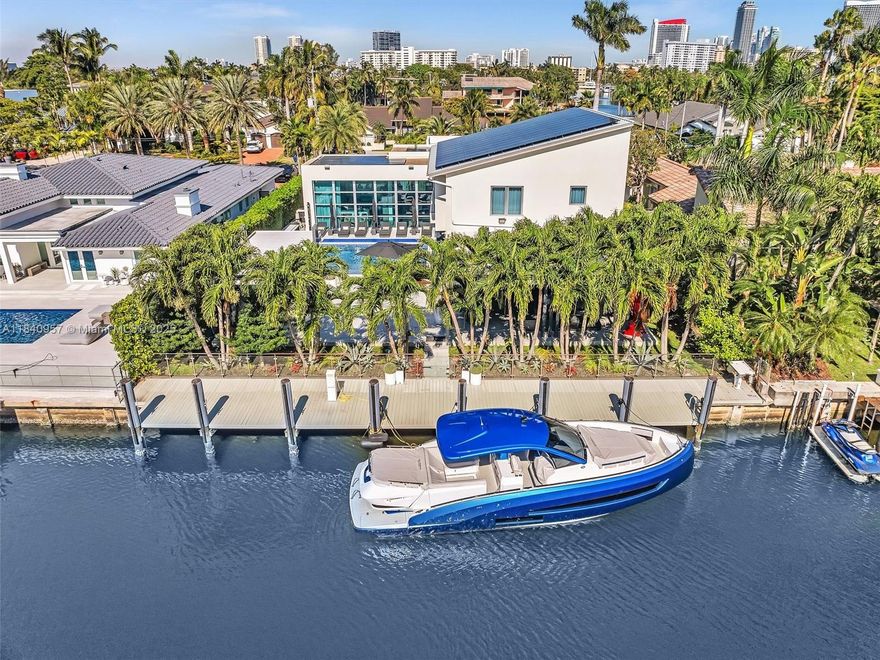 Experience the ultimate waterfront lifestyle in this contemporary estate in the guard-gated Golden Isles. This move-in-ready home features a sleek, modern design with abundant natural light and high-end finishes. The open layout includes spacious living, dining, and family areas, plus a chef-style kitchen with water views. Upstairs, the private master suite offers a spa-inspired bath, sitting area, and balcony. Enjoy the outdoors with a resort-style heated pool, summer kitchen, and large patio. Boaters will love the 85 feet of deep-water frontage, full-service dock, no fixed bridges, and no wake zone. A rare home in one of South Florida’s most desirable waterfront communities.