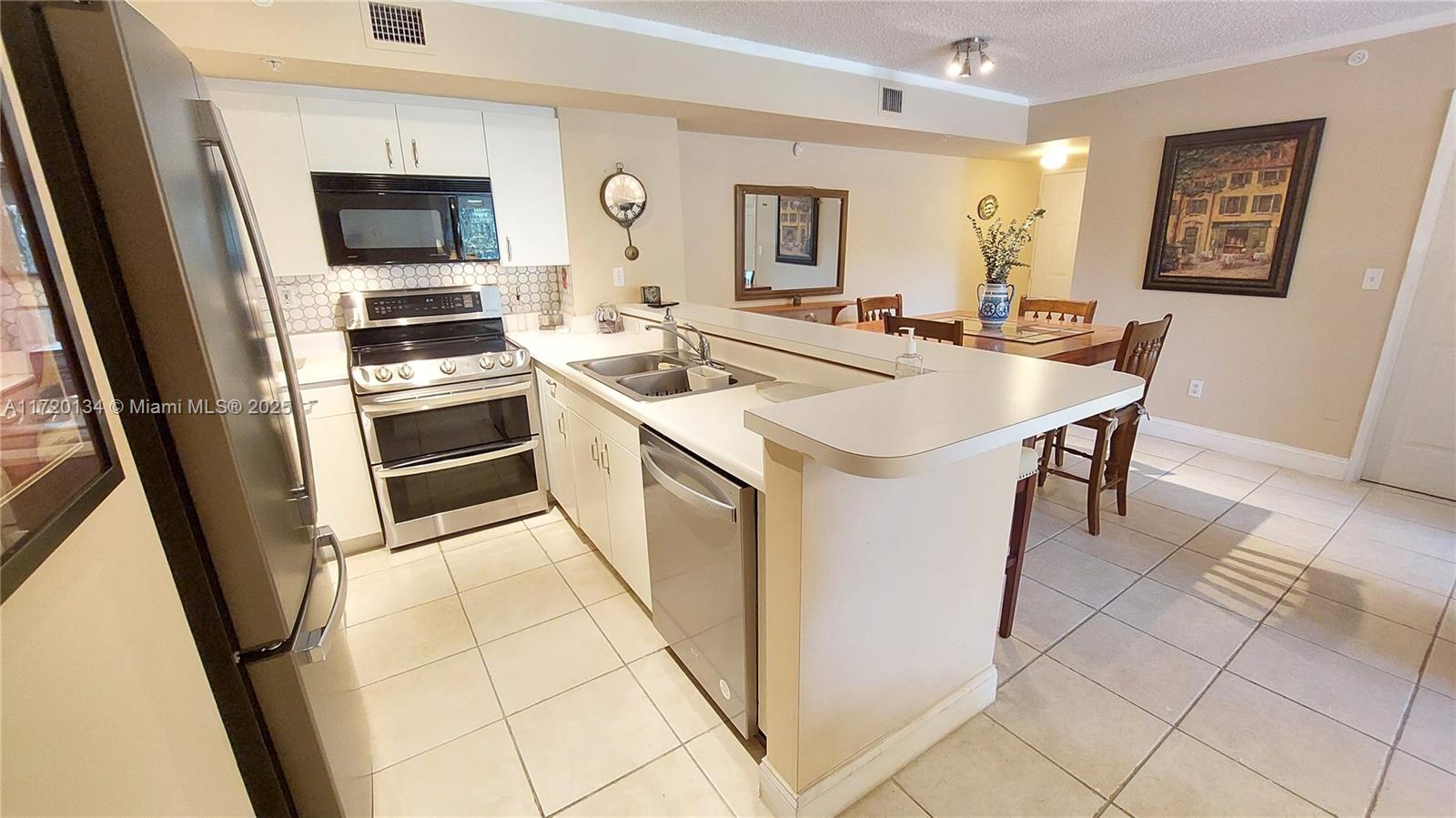 BEAUTIFULLY REMODELED 2-BEDROOM, 2-BATH SPLIT FLOOR PLAN APARTMENT, READY TO MOVE IN, ***>>>FEATURING IMPACT WINDOWS IN ALL BEDROOMS AND SLIDING DOORS.<<<*** IT SHOWCASES A STAINLESS-STEEL REFRIGERATOR, DISHWASHER, AND E-RANGE. CONVENIENTLY SITUATED NEAR NSU, COLLEGES, MALLS, AND SHOPPING CENTERS, WITH EASY ACCESS TO MAJOR HIGHWAYS SUCH AS 595, I-75, I-95, AND THE FL TURNPIKE. LUXURIOUS AMENITIES INCLUDE A CABANA, POOL, BILLIARD ROOM, BASKETBALL, AND TENNIS COURT. THE ASSOCIATION IS CURRENTLY ADDRESSING THE PROJECTS OUTLINED IN THE SPECIAL ASSESSMENTS.