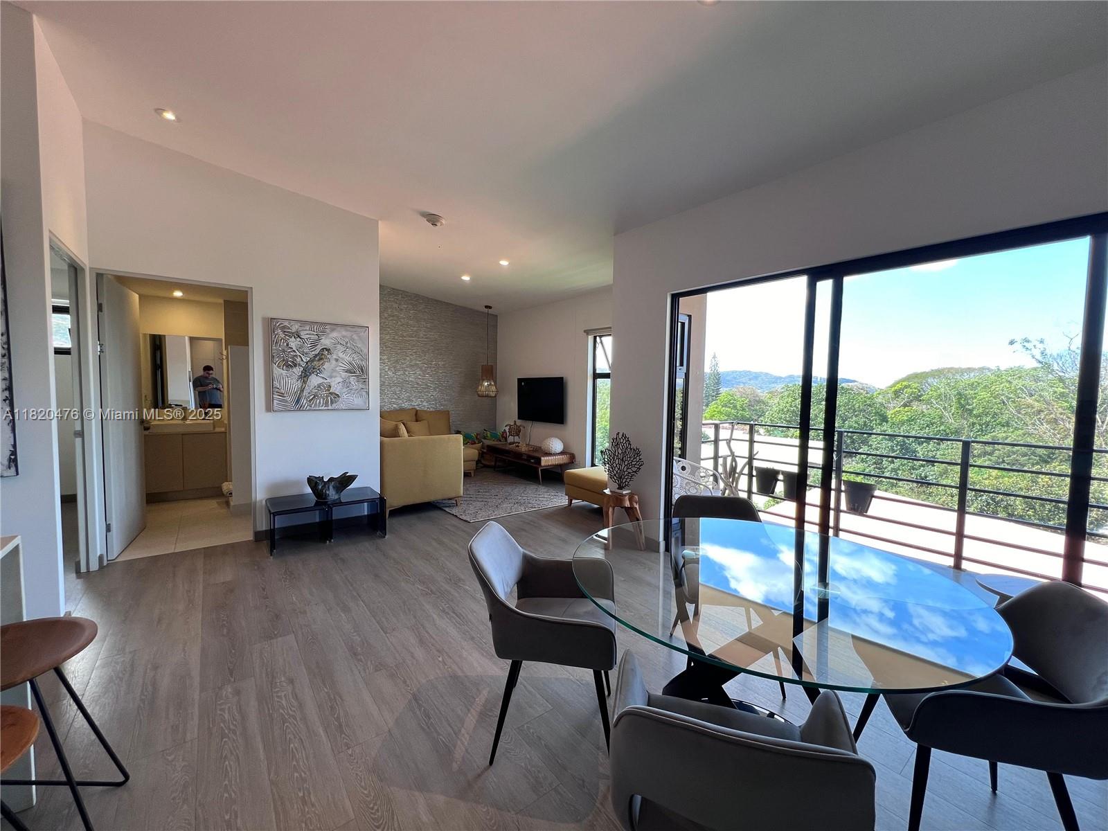 This exclusive apartment condominium, located in Brasil de Mora, Ciudad Colón, is a unique gem that combines luxury, comfort, and breathtaking views. With a spacious layout of 95 m² on the fifth and top floor, this apartment features 2 bedrooms and 2 full bathrooms.
The property offers a balcony with stunning western views, where you can enjoy the best sunsets and the majestic mountains of Rodeo and Atenas.
The condominium offers a wide range of amenities, including a semi-Olympic pool, fully equipped gym, clubhouse with common areas, firepit for social gatherings, and a coworking space with fiber-optic internet and an electric backup system to ensure install chargers for electric vehicles.
Price: $240,000
HOA Fee: 140,000 colones